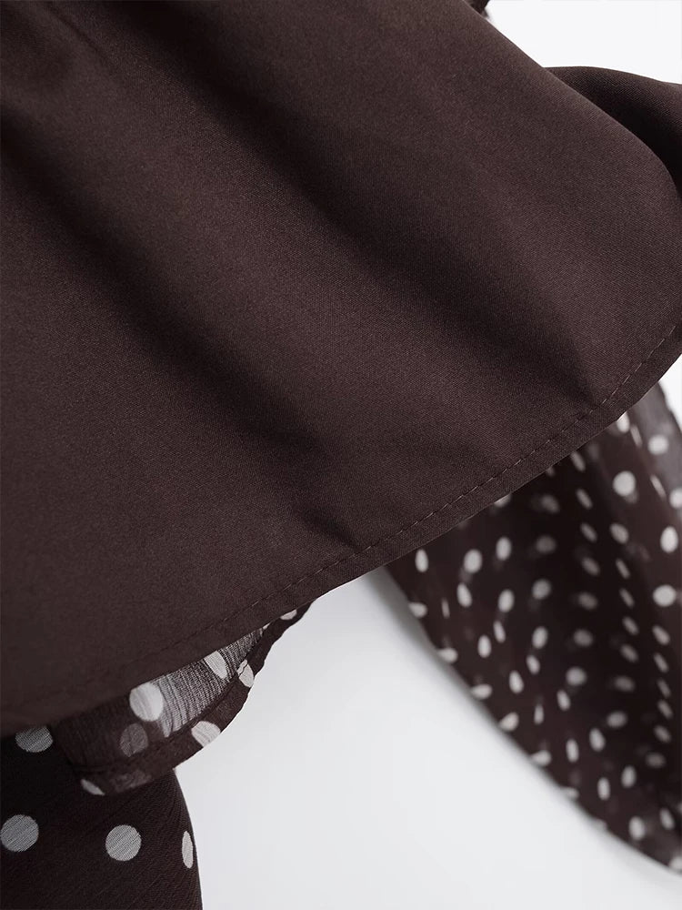 Blusa de lunares con lazo en el cuello