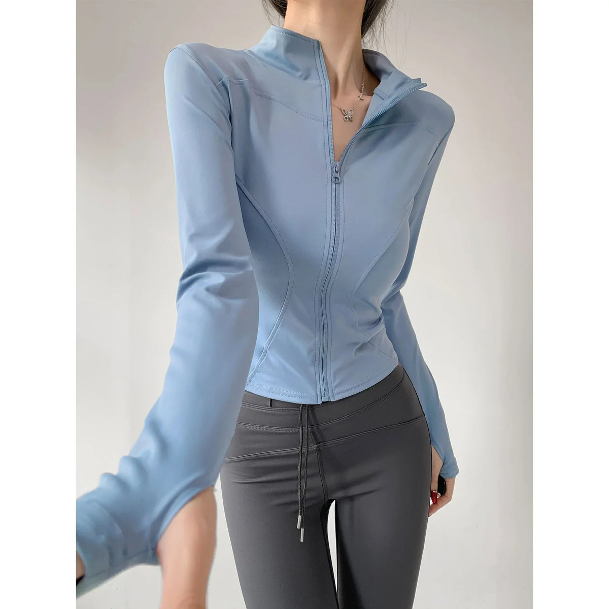 Chaqueta deportiva ajustada de secado rápido para mujer