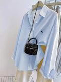 Blusa estampada con botones de manga larga