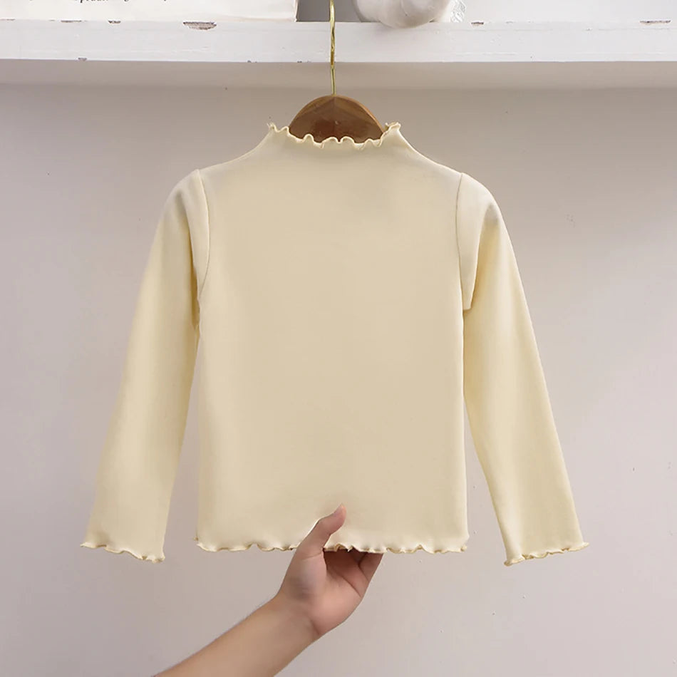 Camiseta de manga larga con cuello de volante para niña