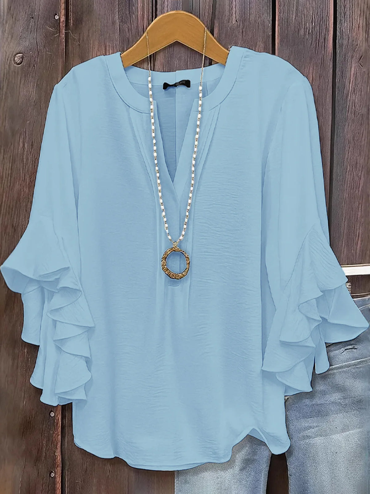 Blusa de gasa con manga de volantes y cuello en V